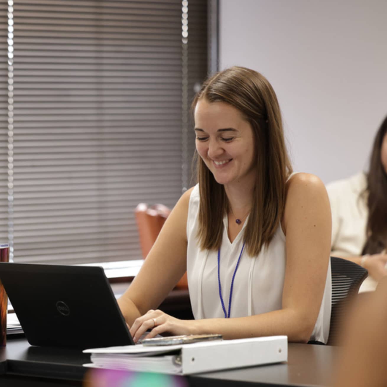 student coach using laptop to connect with client